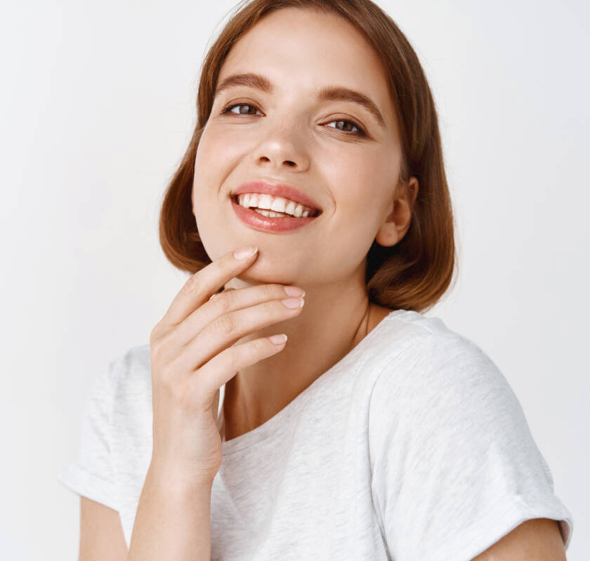 healthy smiling patient with restored teeth